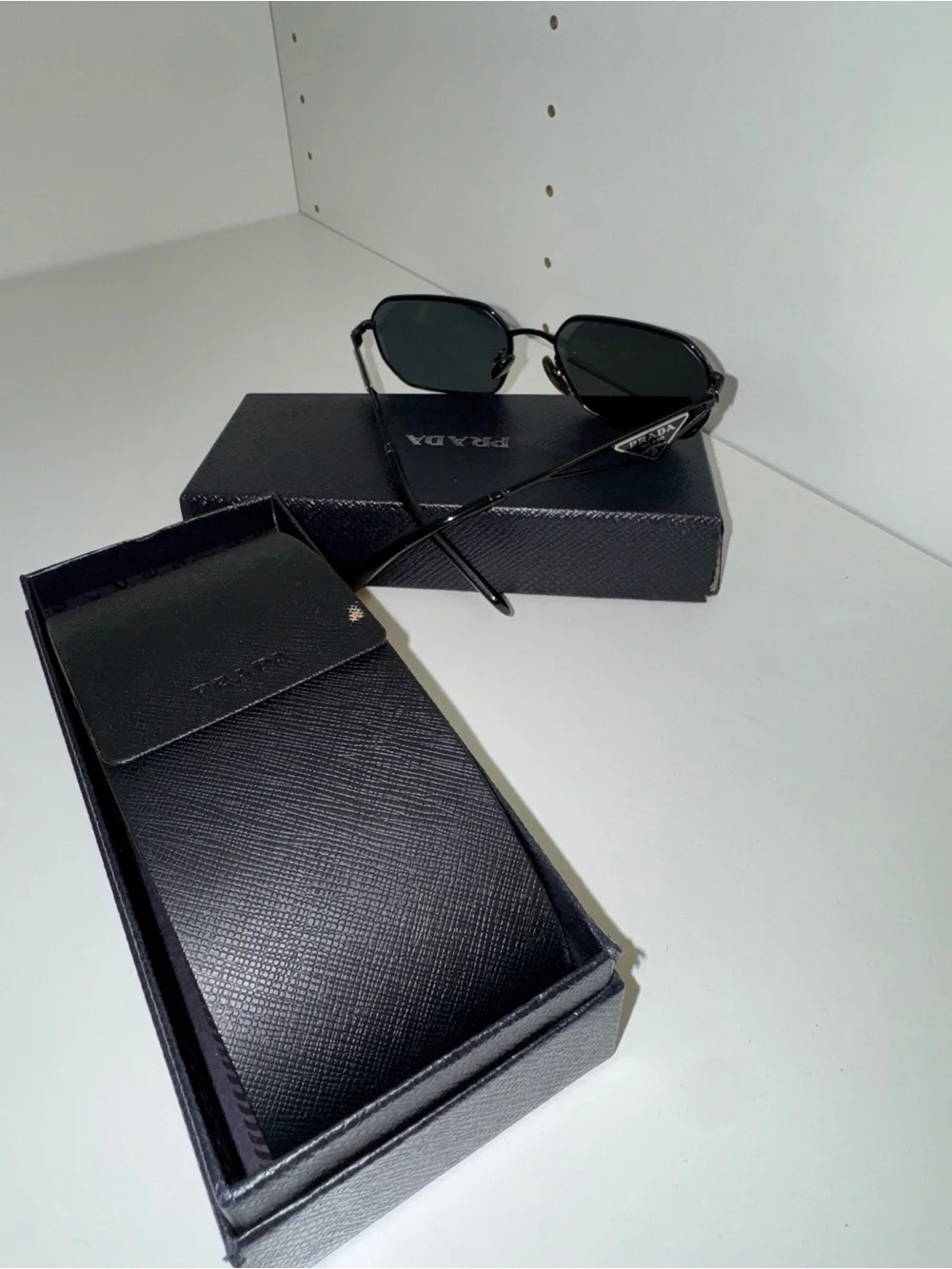 Prada Women’s Black Metal Frame Sunglasses with Dark Lenses
